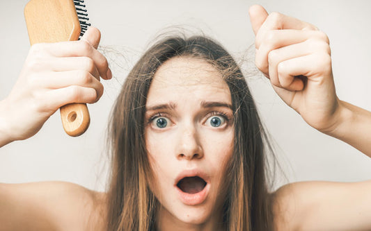 woman showing hair loss